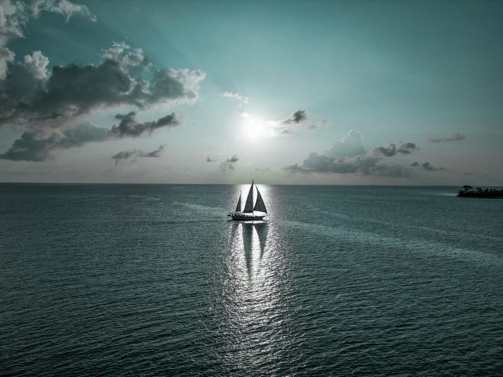 aerial view of sailing boat in the ocean