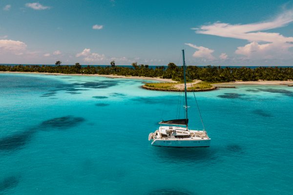 aerial view of Dive Butler catamaran Jolly Roger next to an island