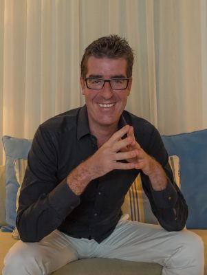 Dive Butler International Co-Founder & Managing Director Alexis Vincent sitting and smiling at the camera with his hands together