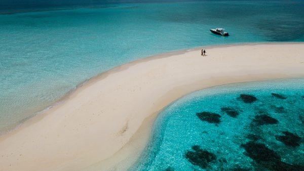 Dive Butler Maldives Couple on Sandbank with Luxury Speedboat