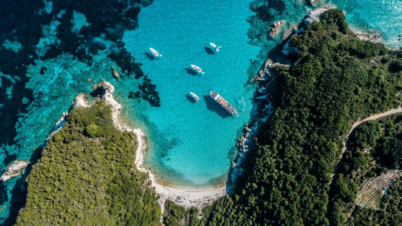 aerial view of the beautiful coastline of antipaxos with luxury yachts in a small cover